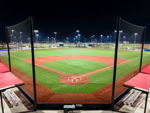 Softball field at Glen Ellyn's Ackerman Park lit at night with Musco LED fixtures