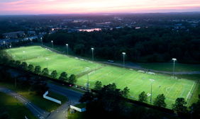Softball field at Glen Ellyn's Ackerman Park lit at night with Musco LED fixtures