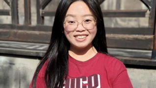 Arina in a red shirt in Chiang Mai, Thailand.