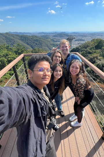 Five students on an overlook platform in Japan.