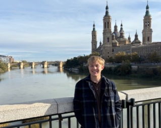 Luke standing on a bridge in Bilbao, Spain.