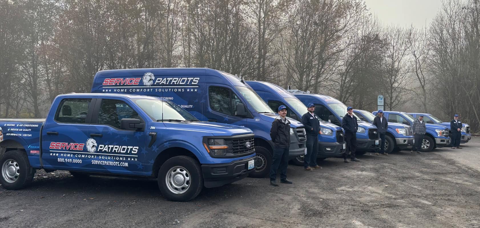 Service Patriots service team with branded vans
