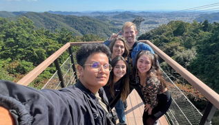 Five students on an overlook platform in Japan.