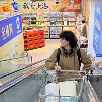 A person pushing shopping cart
