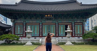 A woman looking at a temple