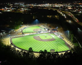 Softball field at Glen Ellyn's Ackerman Park lit at night with Musco LED fixtures
