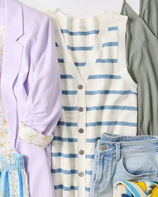 Green floral sleeveless dress draped over a modern chair and styled with a brown belt, light blue blazer, and sunglasses on the seat. The outfit is arranged as a complete warm weather look against a neutral background to showcase the styling pieces together.