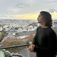 Morgan standing on a balcony looking over Nishinomiya, Japan.