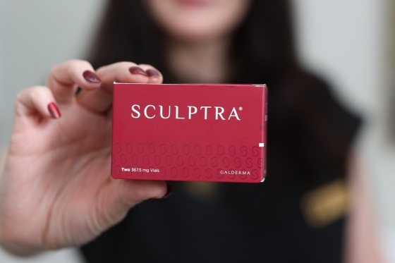 Sculptra product held by a brand representative